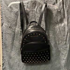 Michael Kors black leather studded adult size backpack no call outs gold tone